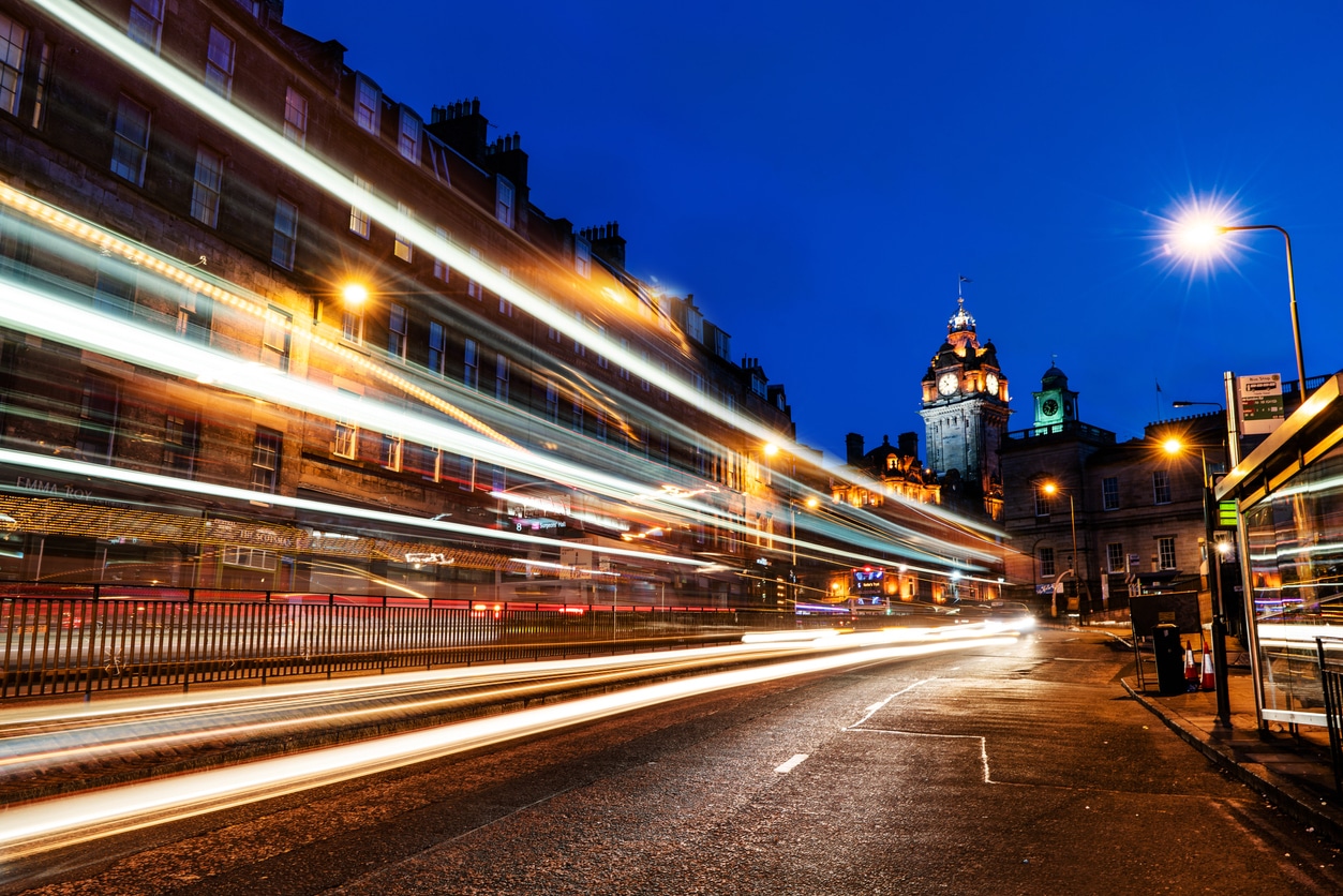 City street at dusk with light trails — delivering today while building for tomorrow